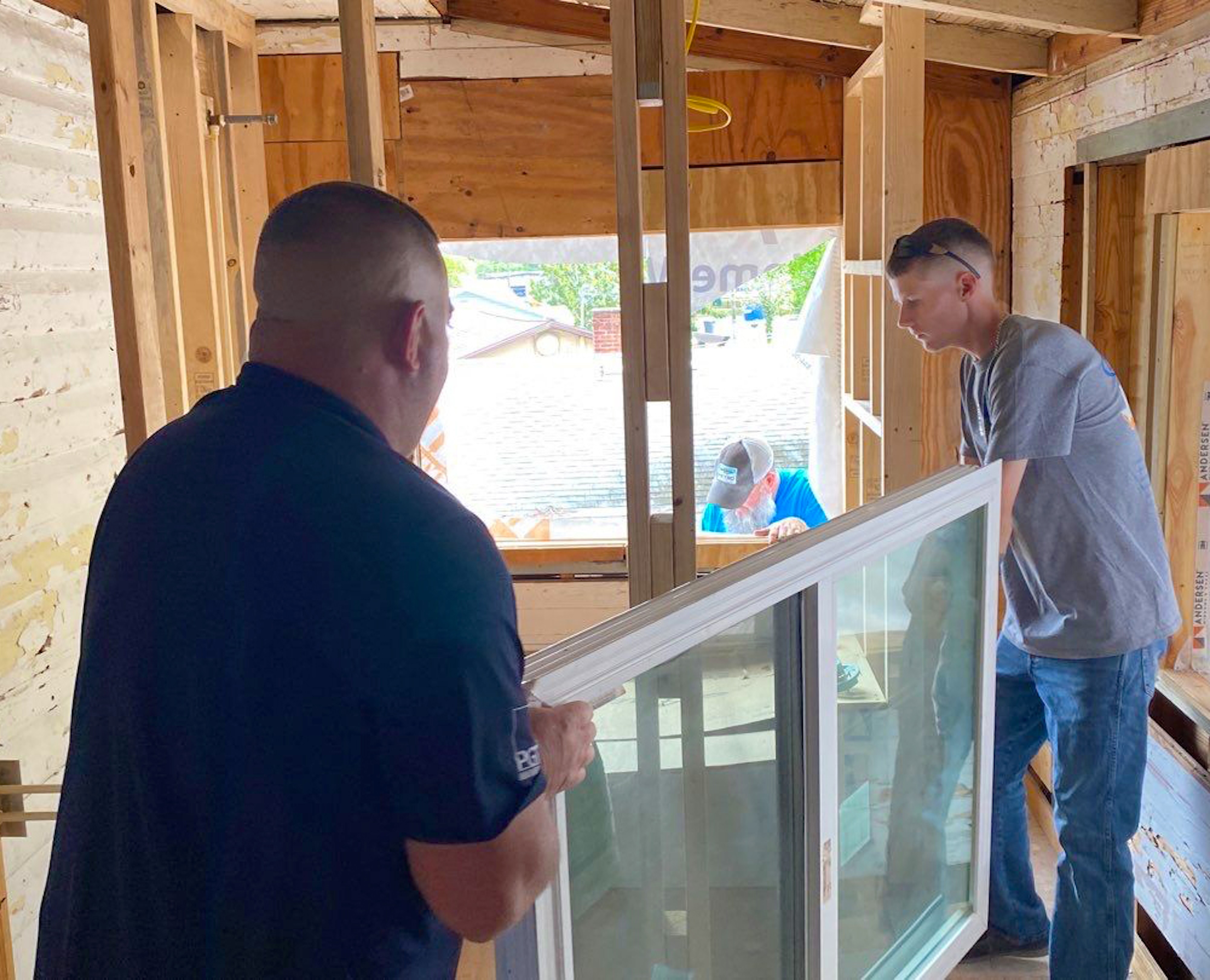 A window being prepared for install by NewSouth Window Solutions' installer team during the NOMORE Foundation donation